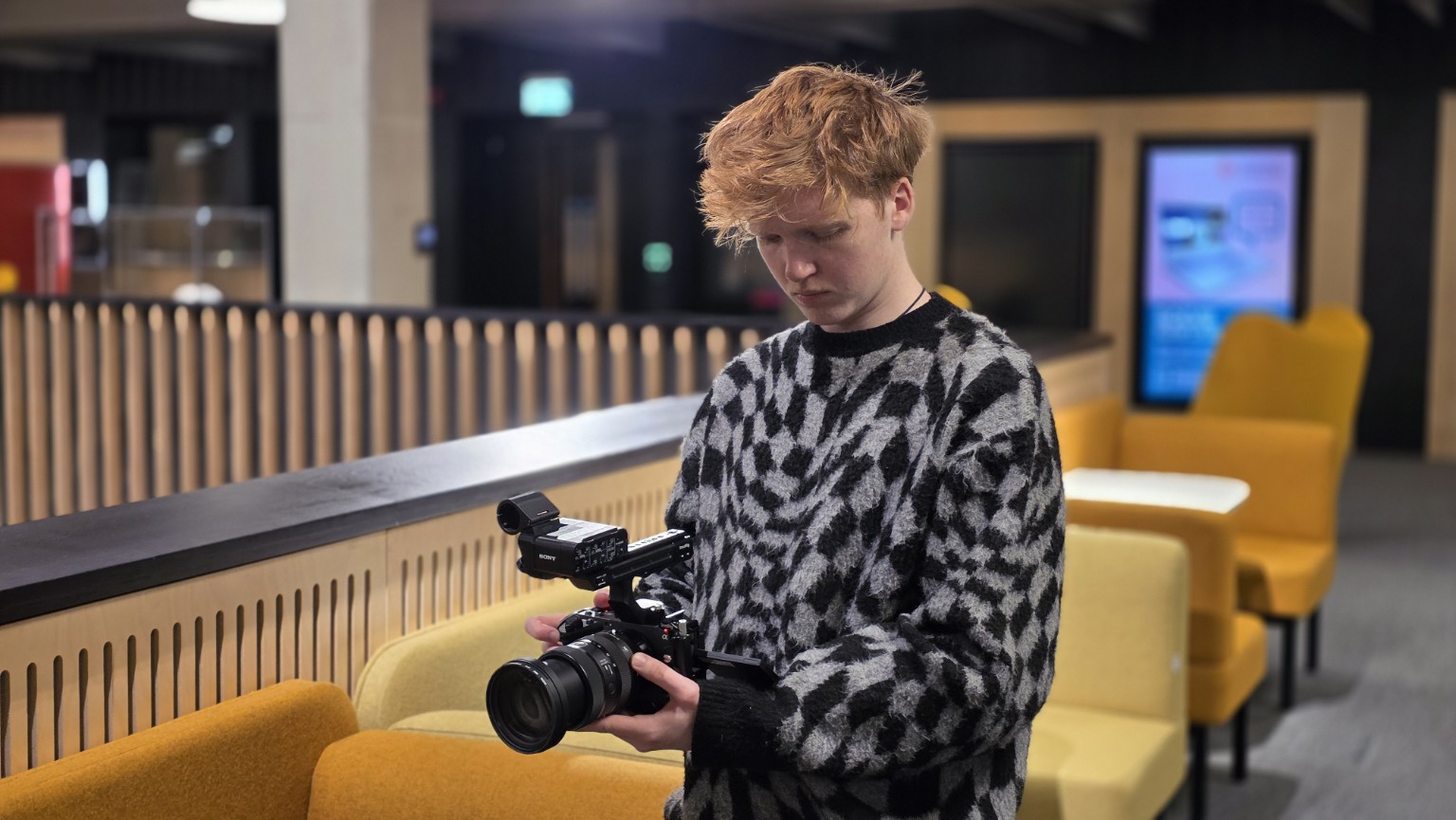 Joe Maclachlan working with a camera