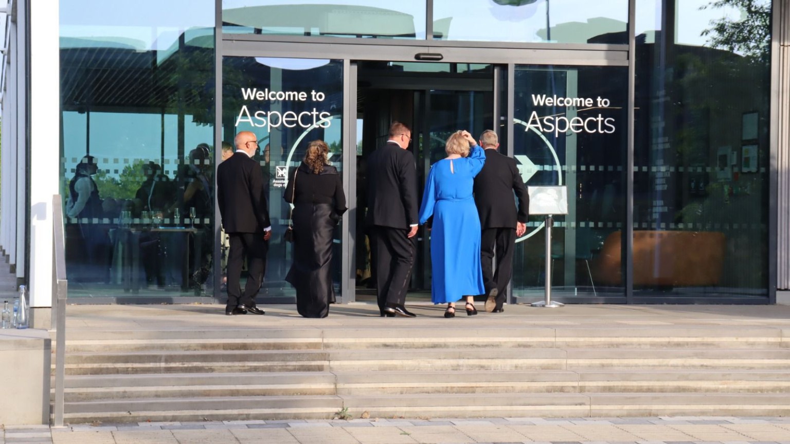 Guests and uniformed participants gathered outside Aspects
