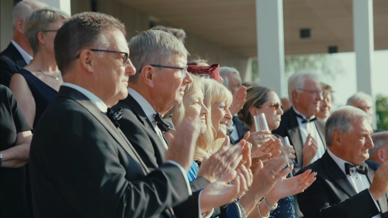 Guests applauding during the retirement ceremony