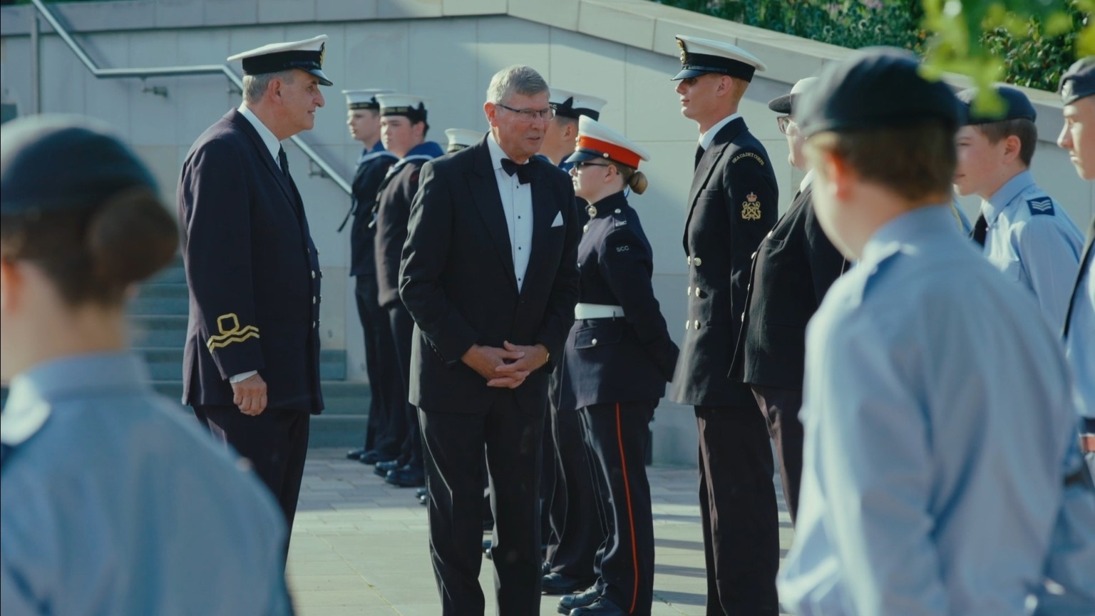 Formal guests and uniformed personnel during the ceremony