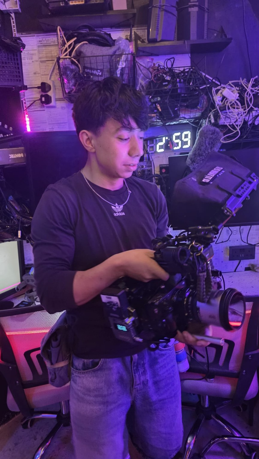 Brandon Riley working with a cinema camera rig