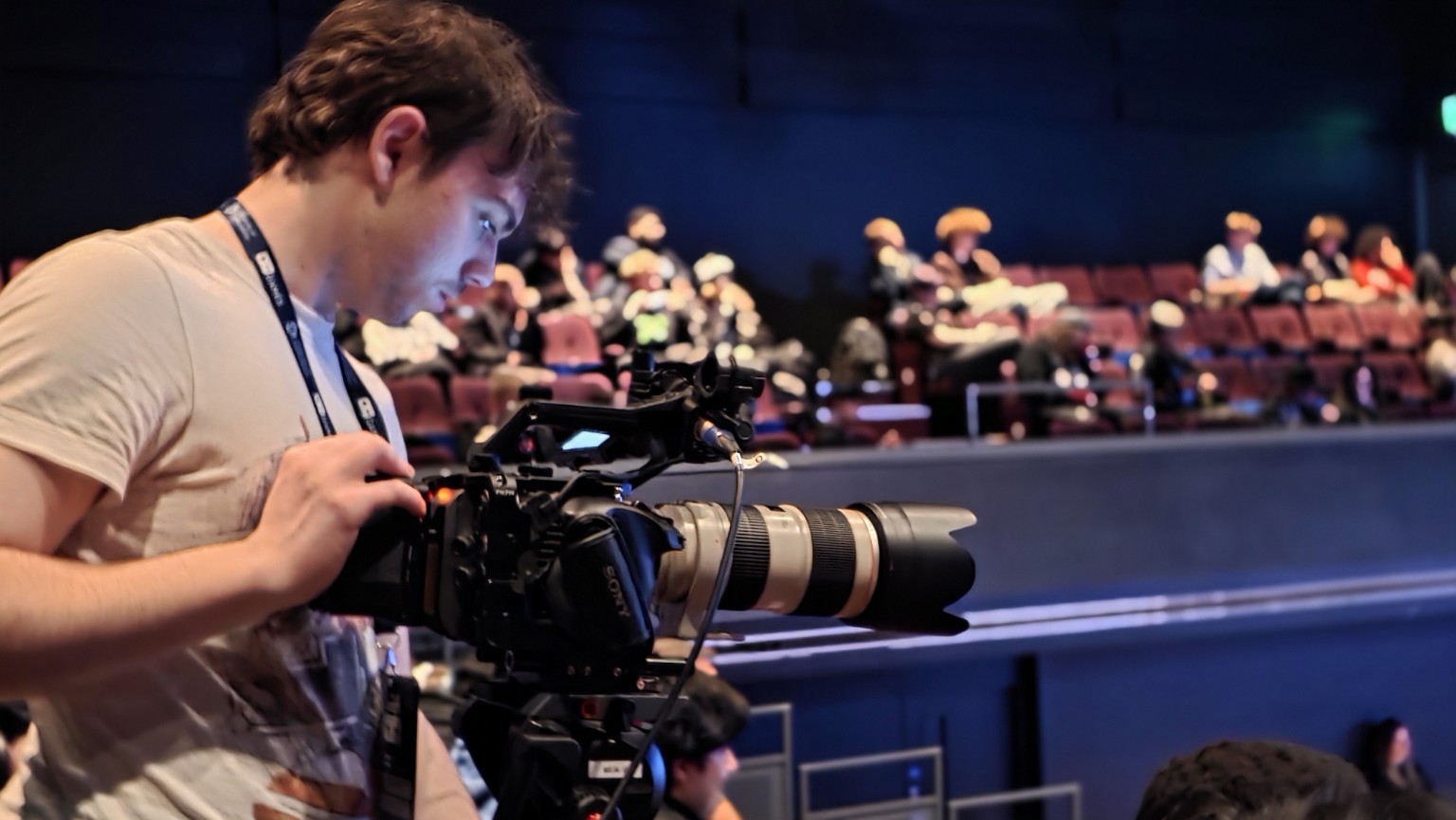 Matthew Lythgoe operating a camera at the event