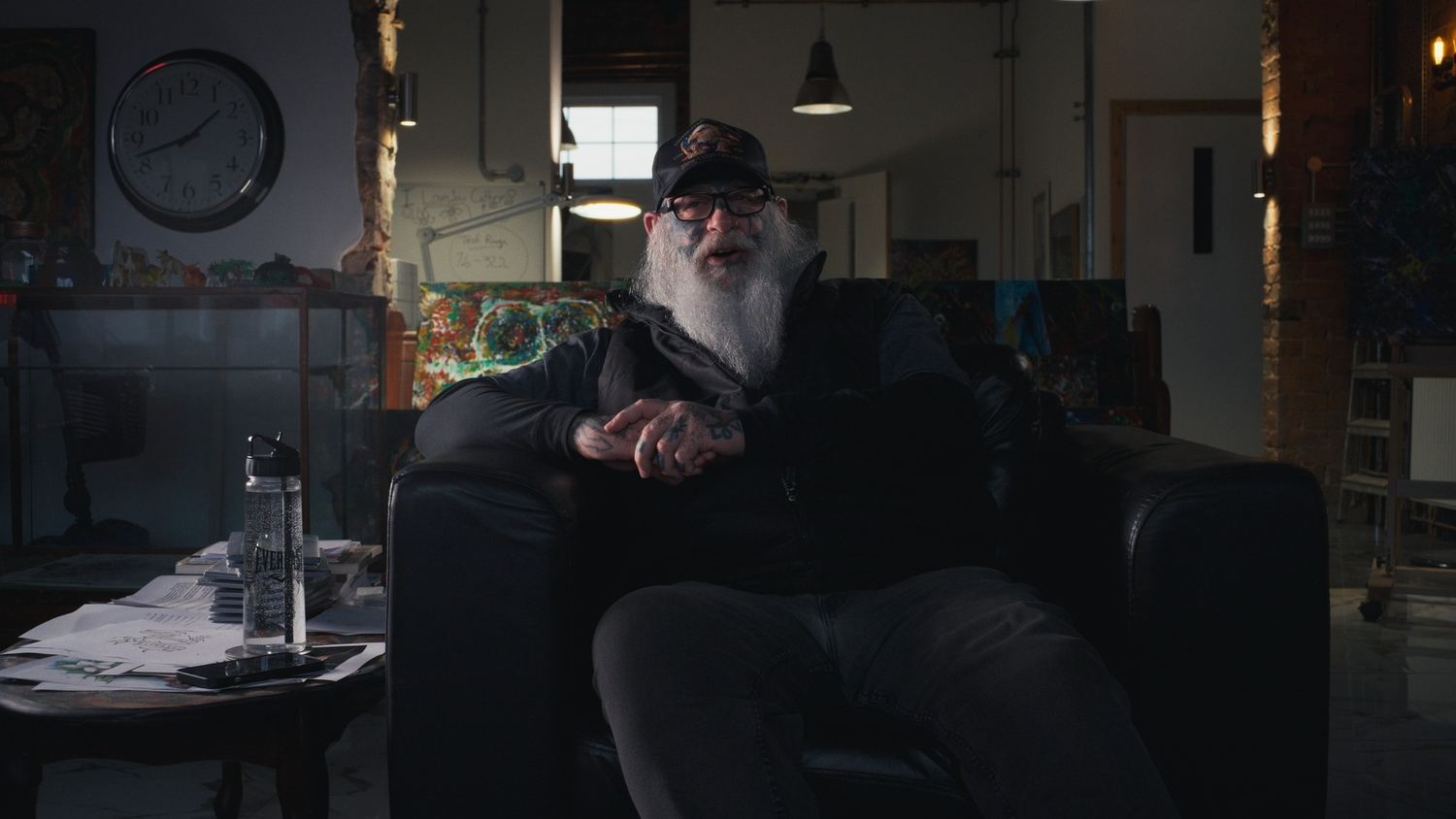 The Scary Guy seated at home during filming