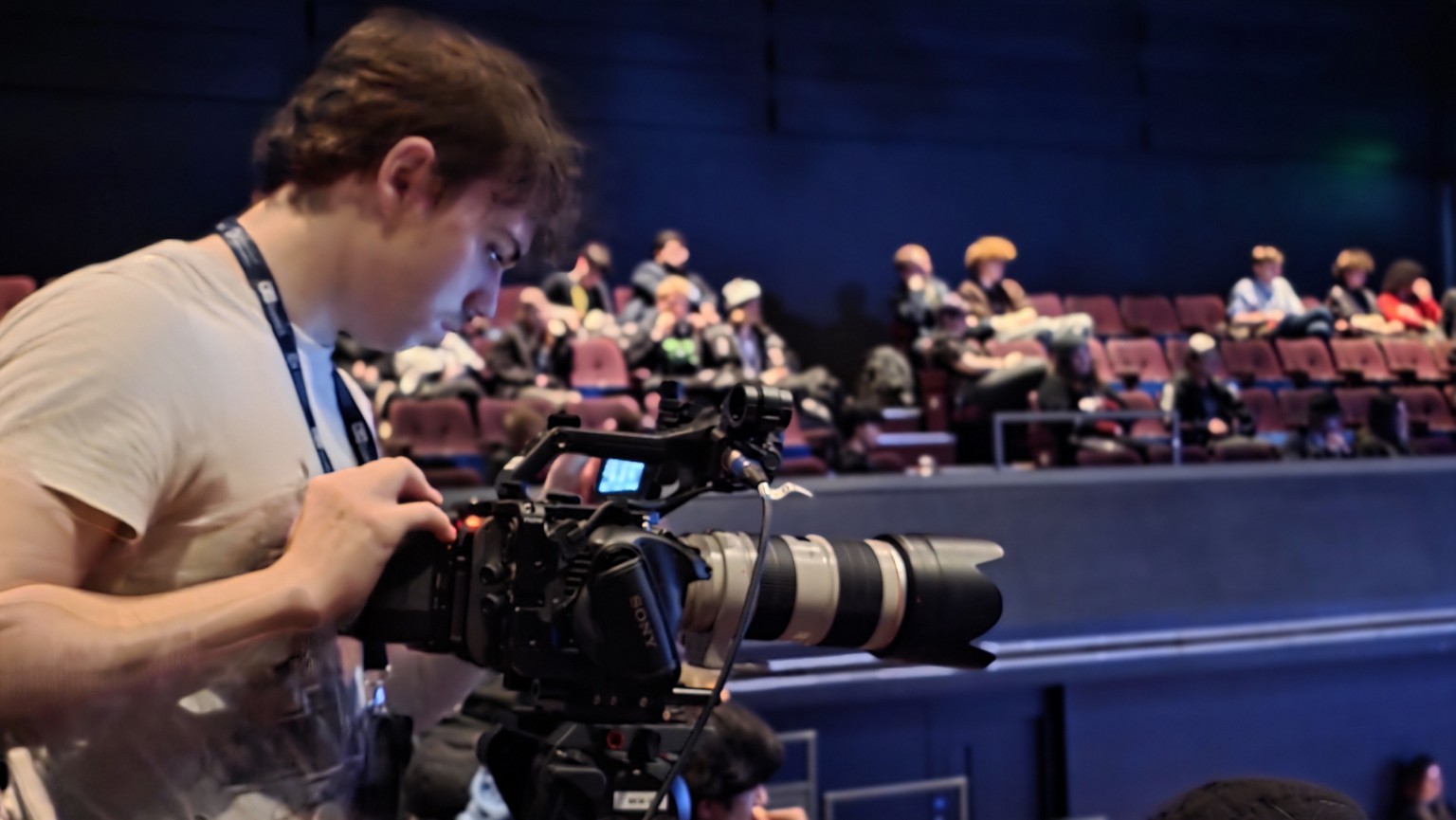Camera operator covering the conference