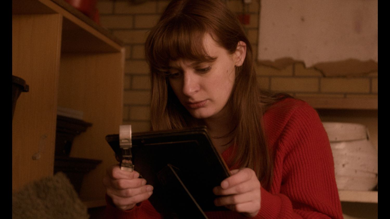 After Francis — Anne holding a photograph
