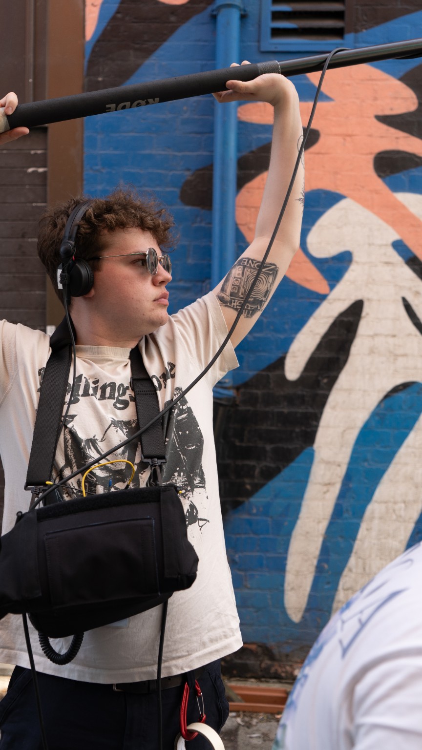 Ewan Venables working as a location sound recordist